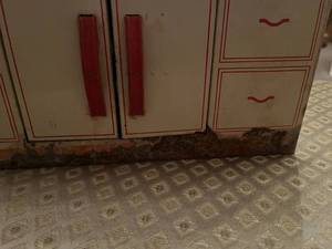 lot 381 image: Light metal play cupboard. Some rust on bottom as shown in picture.