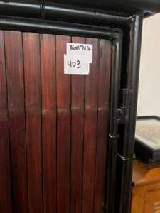 lot 403 image: Bamboo armoire, could be cleaned up really cute. 2 basket drawers.