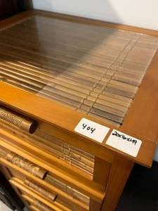 lot 404 image: Bamboo tall drawers with glass top. Drawers all in working order. 49x20x16
