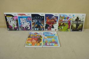 lot 184 image: 8 Nintendo WII Games -Just Dance, Tetris, COD, Avatar, Kid Fit