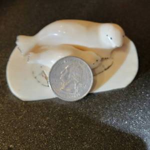 lot 30 image: Alaskan Carved Bone Seal & Pup Figurine