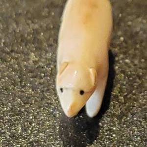 lot 32 image: Alaskan Carved Bone Artic Fox Figurine
