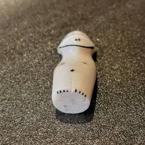 lot 36 image: Alaskan Carved Bone Smiling Pendant Figurine