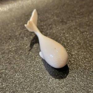 lot 31 image: Alaskan Carved Bone Whale Figurine