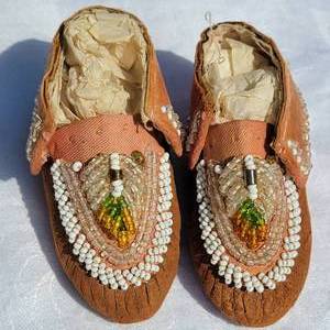 lot 5 image: Vintage Amber  Clear  White Beaded Childs Indian Moccasins  Dark Tanned Hide & Fabric