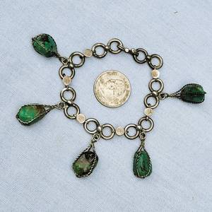 lot 71 image: Heavy Sterling Silver Caged Green Turquoise Stone Charm Bracelet
