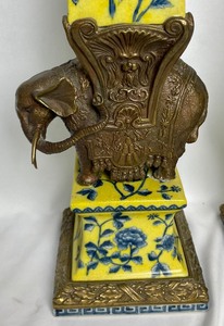 lot 13A image: Pair of Brass Elephant-Mounted Porcelain Obelisks Inspired by Gian Lorenzo Bernini