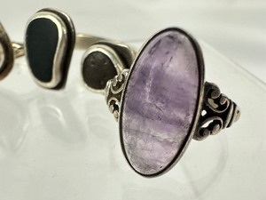 lot 214 image: Collection of Four Unique Rings including an Amber and Sterling Ring