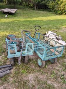 lot 150 image: Two 4 wheel green metal carts with 4 extra wheels & tires. Need repairs
