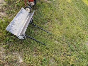 lot 153 image: Metal snow shovel rolling snow pusher with wheels
