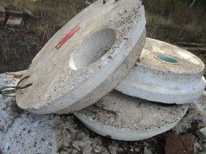 lot 24 image: Cement Sewer Hole Covers