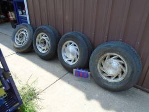 lot 101 image: Qty of 4 Ford 2357515 wheels & tires Metric used condition. As shown. Holding air.