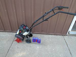 lot 107 image: 4 Ql mini 2 cycle mini roto tiller. Looks unused. As shown.