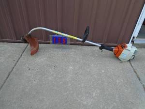 lot 125 image: Older Stihl weed trimmer. Used condition. Tested & works. As shown.