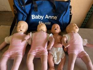 lot 6 image: MSRP $1800 Laerdal Baby Anne 3-Pack Infant CPR Trainer Training Manikin with Bag&nbspPlus Extras Including&nbspPediatric ALS Trainer Infant Baby - All Great Condition