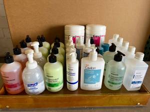 lot 12 image: Lot of Various Soaps, Sanitizers, Lotions, Disinfectant Sprays, Towelettes and First Aid Antiseptics On A Folding Wood Breakfast TV Tray