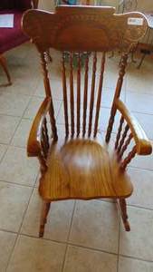 Oak Press Back Rocker with Wolf Heads on the Top