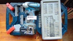 Drill with 2 cases of bits
