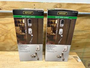 lot 22 image: DEFIANT Lot of 2- Castle Satin Nickel Entrance Door Handlesets with Hartford Interior Knobs