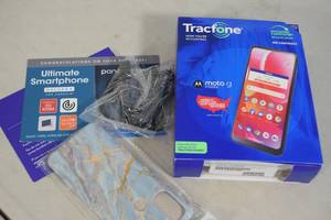 lot 101 image: Mototola Tracfone Smartphone with Case and Car Charger