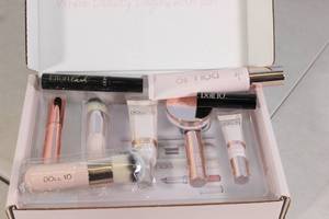 lot 26 image: Doll 10 Box of Makeup Products