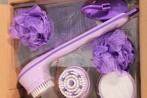 lot 44 image: NEW - Spin Spa Battery Operated Electric Shower Scrubber w Multiple Head Attachments, Suction Shower Hook, Mesh Bag, and Spa Headband