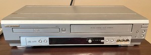 lot 69 image: Sylvania VCRDVD Player with Remote