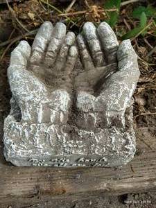lot 305 image: Garden Statue By His Hands We are Fed