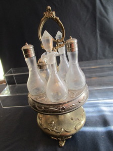 lot 57 image: Table set cruets, shaker, holder...
