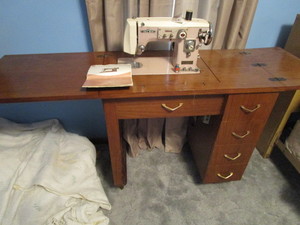lot 152 image: DeLuxe zigzag cabinet sew machine, ...