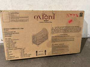 lot 16 image: Oxford Baby Everlee Modern High Arch 3-in-1 Convertible Island Baby Crib with Round Spindles in Honey Wood