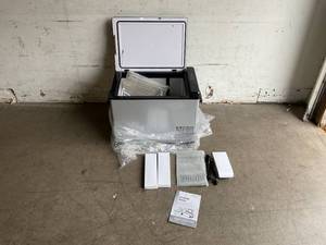 lot 21 image: KEED BING 42 qt Carbon Steel Shell Portable Refrigerator