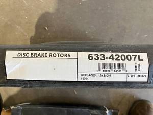 lot 334 image: Set of 2 - Dynamic Friction Drilled and Slotted Black Zinc Brake Rotors - 633-42007L