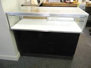 DISPLAY CABINET WITH STORAGE IN BOTTOM - APPROX 48long - 42high - 22deep - SOLID PIECE - CAN BE LIGHTED - BRING HELP TO REMOVE