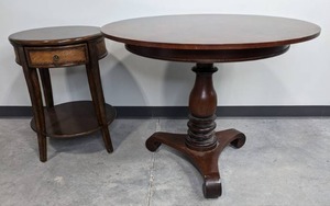 lot 32 image: Milling Road Round Wood Pedestal Dining Table and One Drawer Round Wood Side Table Stand D