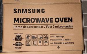lot 9A image: Brand New Samsung 1.6 cu. ft. Over-the-Range Microwave in Stainless Steel with Auto Cook O