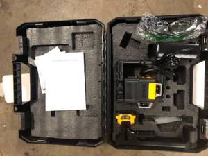 lot 14 image: 12V MAX Lithium-Ion 165 ft. Green Self-Leveling 2 X 360 Degree Line Laser with Battery 2Ah, Charger, & TSTAK Case by DEWALT Customer Returns See Pictures