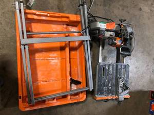 lot 42 image: RIDGID 12 Amp 8 in. Blade Corded Wet Tile Saw with Extended Rip  Customer Returns See Pictures
