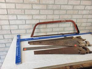 lot 177 image: Aluminum Drywall T-Square (Bent), Framing Square and Assorted Hand Saws - NO SHIPPING