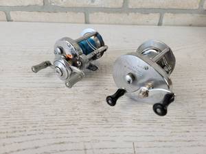 lot 179 image: (2) Baitcast Reels - Pflueger Akron Model 1895 and Shakespeare Direct-o-Drive No. 1950 Model EH
