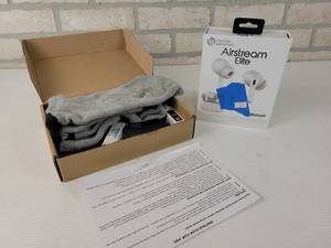 lot 327 image: Airstream Elite Bluetooth Earbuds and New Electric Socks