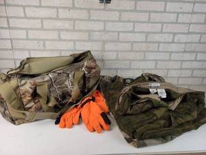 lot 338 image: Hunting Camo Pants and More - Cabelas 44 Reg and Columbia 90% Wool 44, Kings River Camo Duffel Bag, Blaze Orange Hat and Gloves