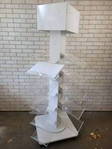 lot 391 image: Rotating & Rolling Literature Display - Metal Stand and Plexi-Glass Shelves - Breaks down easily for transport - Plexi-Glass Platforms are 10 x 14 - NO SHIPPING