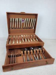 lot 606 image: Set of William Rogers Silver Plated Flatware and Partial Set of National Stainless Flatware in Wood Case