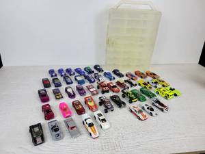 lot 623 image: Lot of (48) 70s, 80s, 90s, and 2000s Hot Wheels, Matchbox, and Racing Champions Cars in Plastic Carrying Case