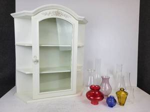 lot 629 image: White Hanging Cabinet with Glass Door and Lot of Misc. Lamp Chimneys - NO SHIPPING
