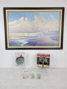 lot 634 image: Beautiful Beach and Lighthouse Print with Pair of Coca-Cola Ornaments, Key Chains, and Schells Brewery Fishing Lure - NO SHIPPING