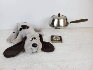 lot 690 image: Vintage Pound Puppy, Aluminum Fondue Pot with Wood Handles, and Vintage Bloomington Dental Lab Magnifier