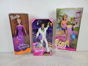 lot 727 image: Set of (3) Barbie Dolls - 2001 Target Exclusive Halloween Princess Barbie, 1998 70s Disco Barbie (Special Edition), and 2016 Stacie & Scooter Doll