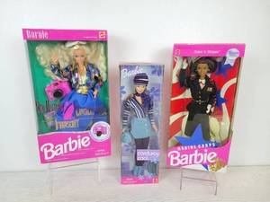 lot 731 image: Set of (3) Barbie Dolls - 1992 Sea Holiday Barbie, 1999 Corduroy Cool Barbie, and 1991 Marine Corps Barbie